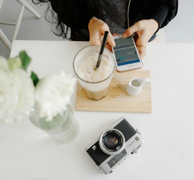 Phone at table with drink